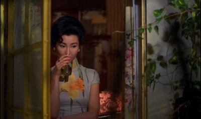 Still from In the Mood For Love (2000) that has been tagged with: medium wide & drinking & night