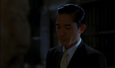 Still from In the Mood For Love (2000) that has been tagged with: 5d8aa8 & over-the-shoulder & medium shot & night