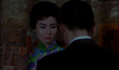 Still from In the Mood For Love (2000) that has been tagged with: 000000 & over-the-shoulder & medium close-up & night
