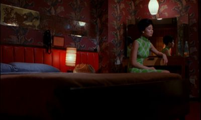 Still from In the Mood For Love (2000) that has been tagged with: mirror & practical lamp & bedroom
