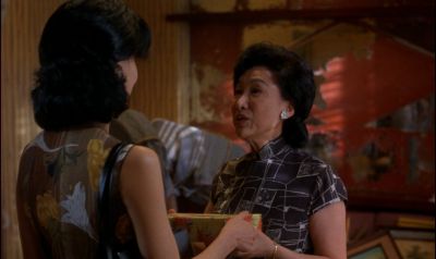 Still from In the Mood For Love (2000) that has been tagged with: b94c46 & over-the-shoulder & medium shot