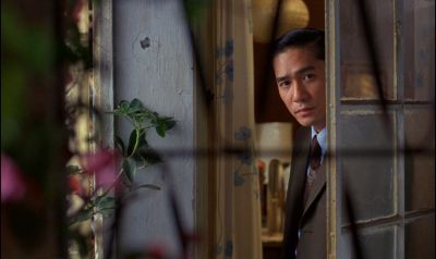 Still from In the Mood For Love (2000) that has been tagged with: 8f5b5b & day & medium shot & interior