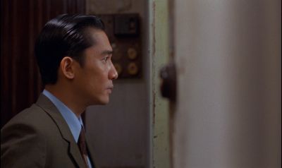 Still from In the Mood For Love (2000) that has been tagged with: night & interior & doorway & profile shot