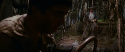 Still from Indiana Jones and the Raiders of the Lost Ark (1981) that has been tagged with: over-the-shoulder & jungle