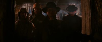 Still from Indiana Jones and the Raiders of the Lost Ark (1981) that has been tagged with: group-shot & night & medium shot