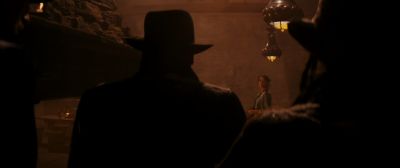 Still from Indiana Jones and the Raiders of the Lost Ark (1981) that has been tagged with: 000000 & silhouette & over-the-shoulder & practical lamp