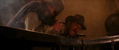 Still from Indiana Jones and the Raiders of the Lost Ark (1981) that has been tagged with: medium shot & two-shot & smoke