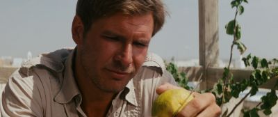 Still from Indiana Jones and the Raiders of the Lost Ark (1981) that has been tagged with: clean single & day & fruit & lemon & medium close-up & cutting
