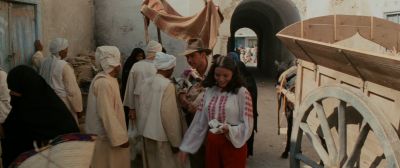 Still from Indiana Jones and the Raiders of the Lost Ark (1981) that has been tagged with: high-angle & medium wide & wagon