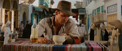 Still from Indiana Jones and the Raiders of the Lost Ark (1981) that has been tagged with: drinking & monkey