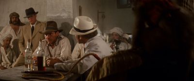 Still from Indiana Jones and the Raiders of the Lost Ark (1981) that has been tagged with: 4d5421 & hookah & medium wide & drinking