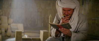Still from Indiana Jones and the Raiders of the Lost Ark (1981) that has been tagged with: turban & reading