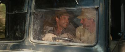 Still from Indiana Jones and the Raiders of the Lost Ark (1981) that has been tagged with: driving & day & two-shot & car interior & car