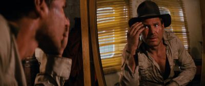 Still from Indiana Jones and the Raiders of the Lost Ark (1981) that has been tagged with: hat & reflection