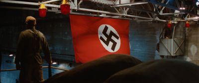 Still from Indiana Jones and the Raiders of the Lost Ark (1981) that has been tagged with: medium wide & swastika