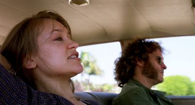 Still from Inherent Vice (2014) that has been tagged with: 6b8f24 & day & two-shot & medium close-up & interior