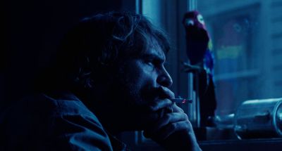 Still from Inherent Vice (2014) that has been tagged with: 4682b4 & medium close-up & night & interior
