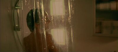 Still from Irréversible (2002) that has been tagged with: over-the-shoulder & day & shower & clean single