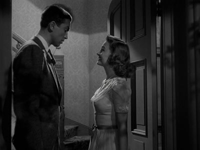 Still from It's A Wonderful Life (1946) that has been tagged with: medium wide & black and white & two-shot & night
