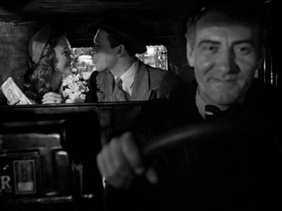 Still from It's A Wonderful Life (1946) that has been tagged with: three-shot & car interior & day