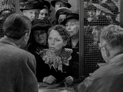 Still from It's A Wonderful Life (1946) that has been tagged with: over-the-shoulder & day & black and white