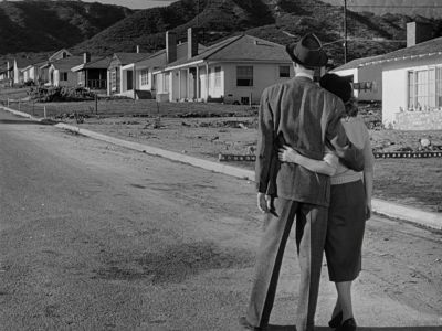 Still from It's A Wonderful Life (1946) that has been tagged with: suburban street & over-the-shoulder