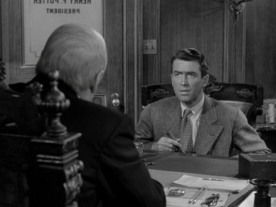 Still from It's A Wonderful Life (1946) that has been tagged with: black and white & over-the-shoulder & medium shot