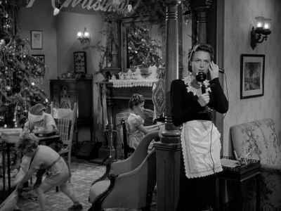 Still from It's A Wonderful Life (1946) that has been tagged with: group-shot & black and white & phone