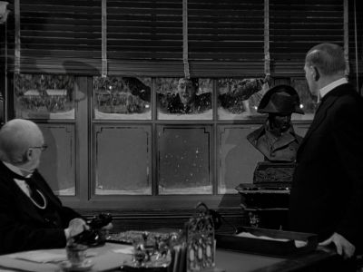 Still from It's A Wonderful Life (1946) that has been tagged with: black and white & snow & over-the-shoulder & interior & wide shot