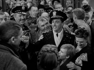 Still from It's A Wonderful Life (1946) that has been tagged with: day & group-shot & black and white & medium wide & exterior
