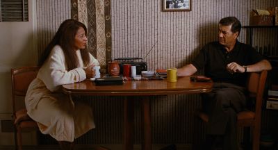 Still from Jackie Brown (1997) that has been tagged with: day & coffee & wide shot & dining room & table