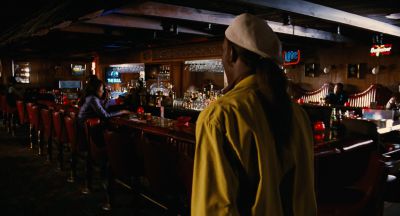 Still from Jackie Brown (1997) that has been tagged with: night & over-the-shoulder & wide shot & bar