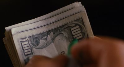 Still from Jackie Brown (1997) that has been tagged with: money & interior & day