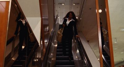 Still from Jackie Brown (1997) that has been tagged with: clean single & mall & escalator & wide shot & interior & day