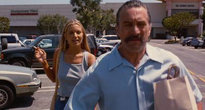 Still from Jackie Brown (1997) that has been tagged with: day & exterior & two-shot & medium wide & smoking