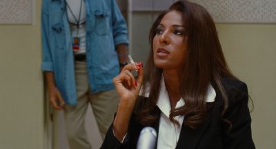 Still from Jackie Brown (1997) that has been tagged with: 2b1508 & medium shot & smoking & day