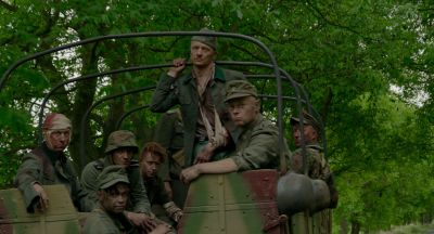 Still from JoJo Rabbit (2019) that has been tagged with: military & day & group-shot & woods & exterior
