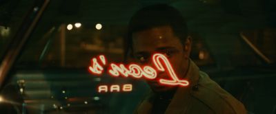 Still from Judas and the Black Messiah (2021) that has been tagged with: car interior & neon