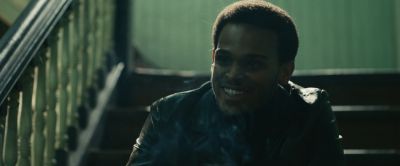 Still from Judas and the Black Messiah (2021) that has been tagged with: interior & smiling