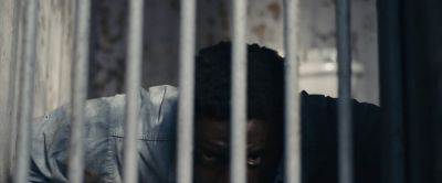 Still from Judas and the Black Messiah (2021) that has been tagged with: day & exercise & prison cell & medium close-up & interior