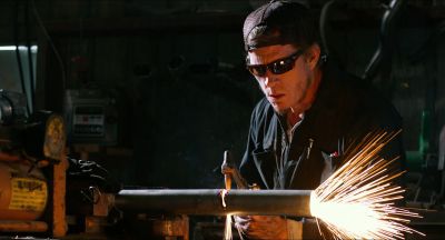 Still from Killer Joe (2011) that has been tagged with: sparks & welding & repairing & day