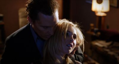 Still from Killer Joe (2011) that has been tagged with: medium close-up & interior & two-shot & night