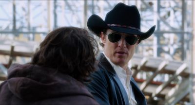 Still from Killer Joe (2011) that has been tagged with: cowboy & sunglasses & two-shot & over-the-shoulder