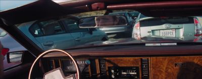Still from La La Land (2016) that has been tagged with: car interior & rearview mirror