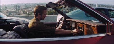 Still from La La Land (2016) that has been tagged with: day & driving & car & exterior