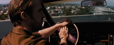 Still from La La Land (2016) that has been tagged with: car interior & rearview mirror