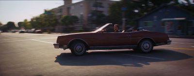 Still from La La Land (2016) that has been tagged with: exterior & wide shot & day & convertable