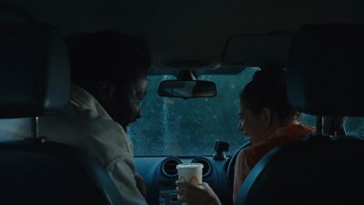 Still from Commercial: McDonald's — "Laughter" that has been tagged with: rain & over-the-shoulder & medium shot & car interior