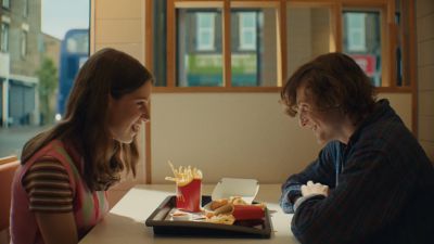 Still from Commercial: McDonald's — "Laughter" that has been tagged with: interior & profile shot & table