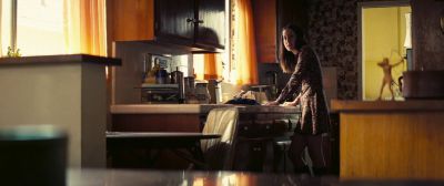 Still from Licorice Pizza (2021) that has been tagged with: interior & wide shot & kitchen